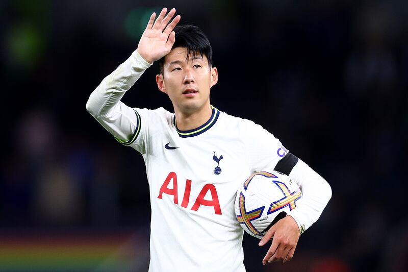 Son Heung-min of Tottenham Hotspur celebrates the 6-2 victory over Leicester with the hat-trick match ball at Tottenham Hotspur Stadium on September 17, 2022. Getty
