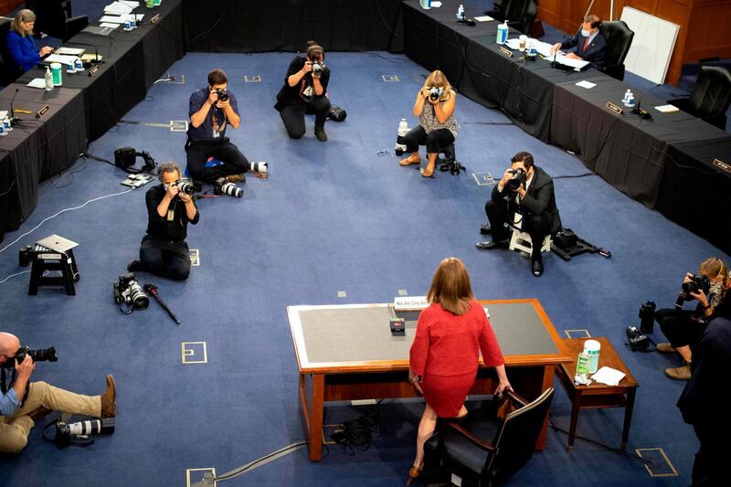 Supreme Court justice nominee Amy Coney Barrett returns from a break during the second day of her Senate Judiciary Committee confirmation hearing in Washington, US.  AFP