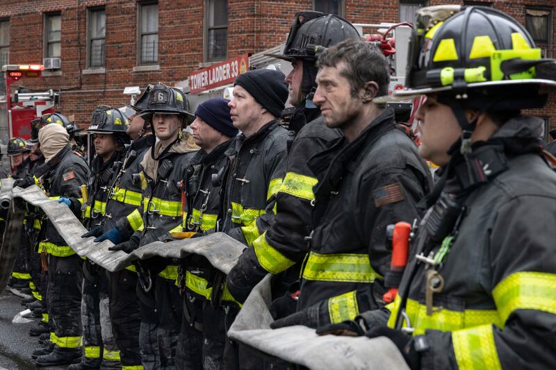 Lining up to tackle the blaze in the Bronx. AP