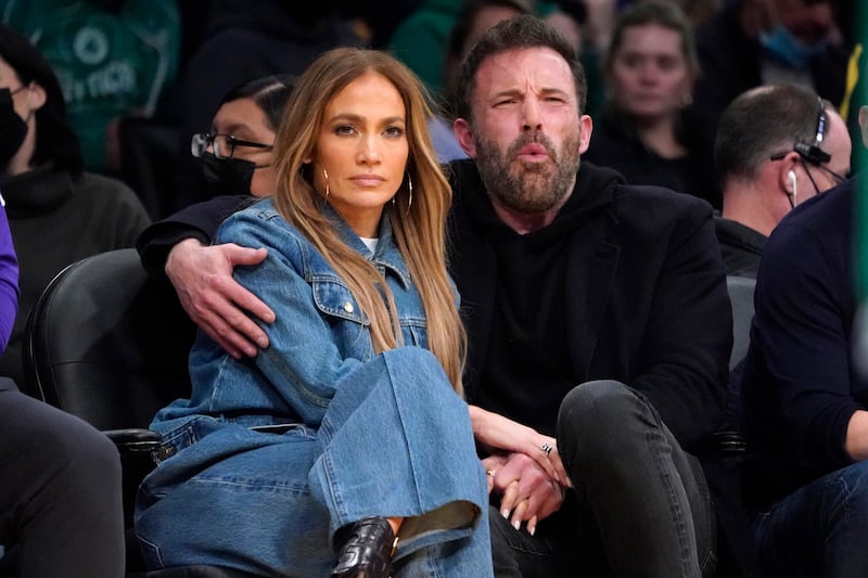 Jennifer Lopez and Ben Affleck attend an NBA basketball game between the Los Angeles Lakers and the Boston Celtics in Los Angeles. The couple started dating again this year. AP