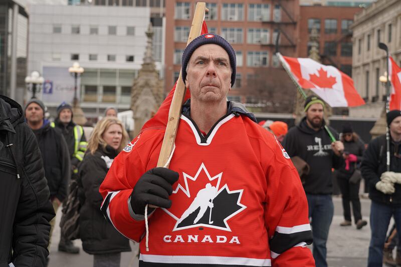 A protester wears a Hockey Canada jersey outside of Parliament. Willy Lowry / The National