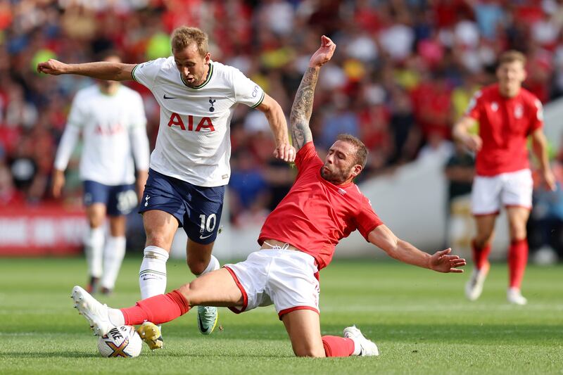 Harry Kane of Tottenham Hotspur and Steve Cook of Nottingham Forest battle for the ball. Getty Images