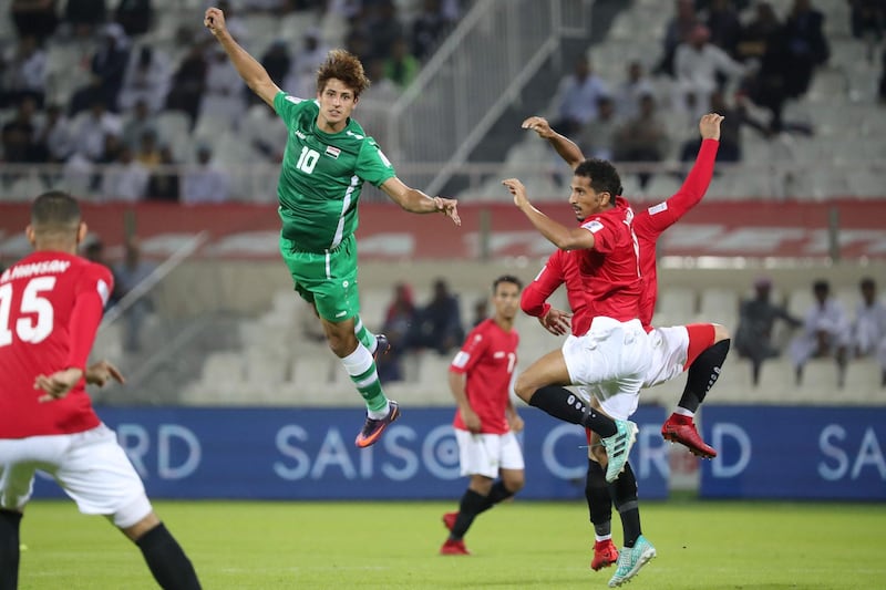 Yemen forward Ahmed Dhabaan, centre, heads the ball. AFP
