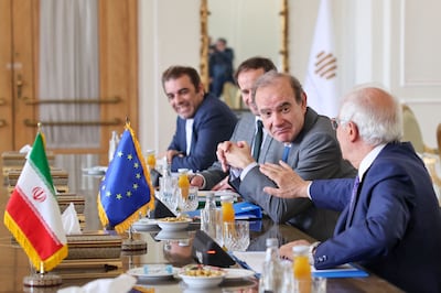 Josep Borell and Deputy Secretary General of the European External Action Service Enrique Mora (2nd-R) chat during a meeting with Iran's Foreign Minister, in Tehran on June 25. AFP