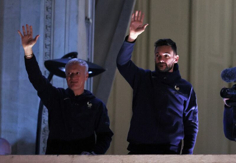 France manager Didier Deschamps and goalkeeper Hugo Lloris greet fans in Paris. Reuters