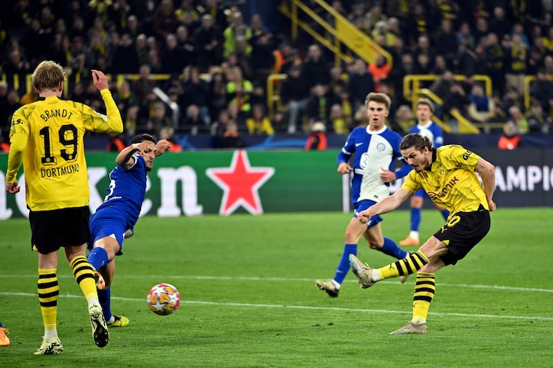 Marcel Sabitzer shoots to score Dortmund's fourth goal in the 4-2 victory over Atletico Madrid. AP