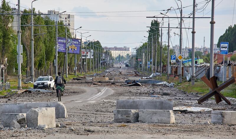 A damaged street on the outskirts of Kharkiv. EPA