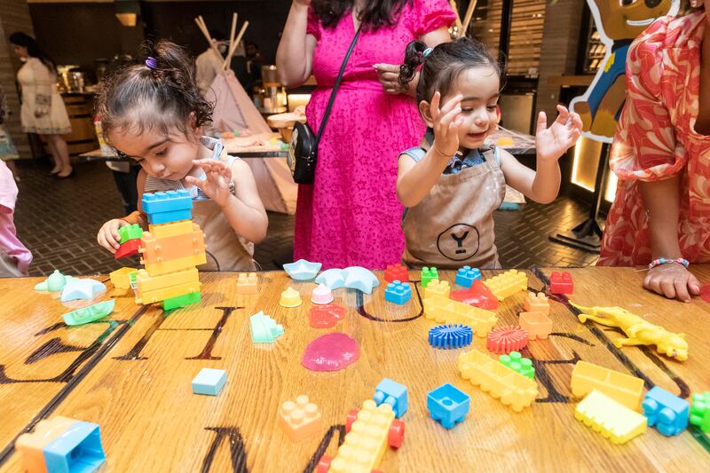 Tables throughout the venue are filled with edutainment toys and activities 