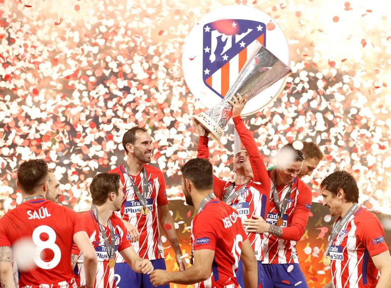 Atletico Madrid players celebrate with the trophy after winning the UEFA Europa League final between Olympique Marseille and Atletico Madrid in Lyon, France, on May 16, 2018. Atletico won 3-0. Yoan Valat / EPA