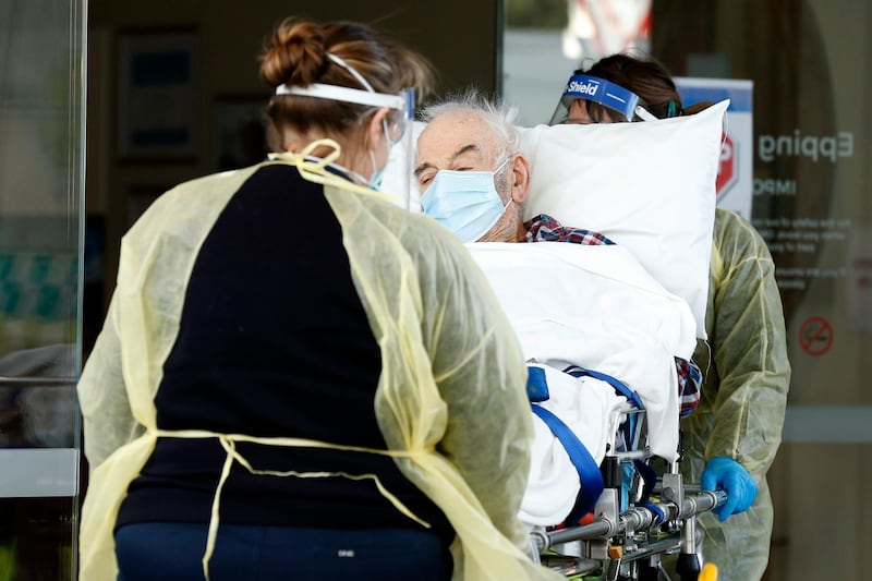 A resident of Epping Gardens Aged Care Facility is taken away in an ambulance in Melbourne, Australia. Getty Images