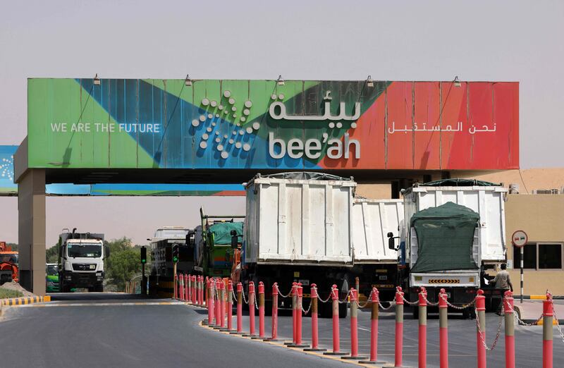 Trucks drive in and out of the Beeah waste management company in Sharjah. AFP