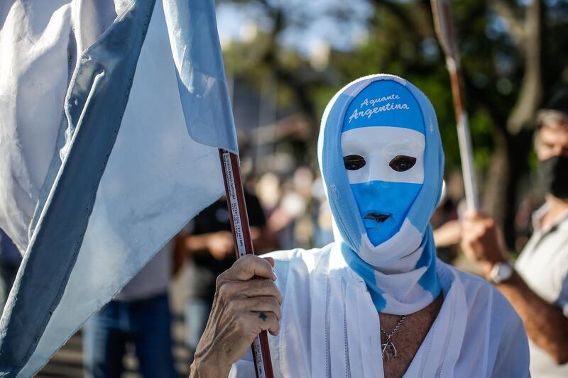 A supporter of the Argentinian President takes part in a counter-march in front of the presidential residence in the town of Olivos, in the province of Buenos Aires, Argentina.  EPA