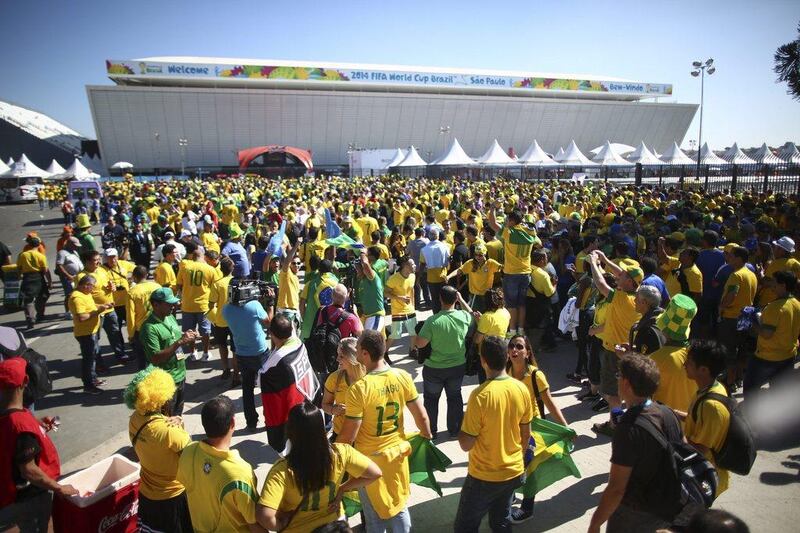 Fans gather outside the Arena Corinthians in Sao Paulo, Brazil, on Thursday prior to the kickoff to the opening match of World Cup 2014. Diego Azubel / EPA
