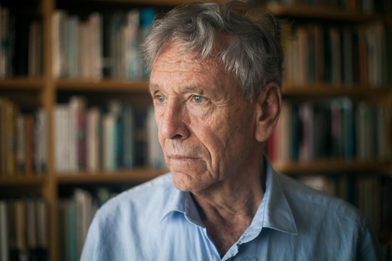 FILE - In this , Wednesday, Nov. 4, 2015 file photo, Israeli writer Amos Oz poses for a photo at his house in Tel Aviv, Israel. Israeli media said Friday, Dec. 28, 2018 that Israeli author Amos Oz has died at the age of 79. (AP Photo/Dan Balilty, File)