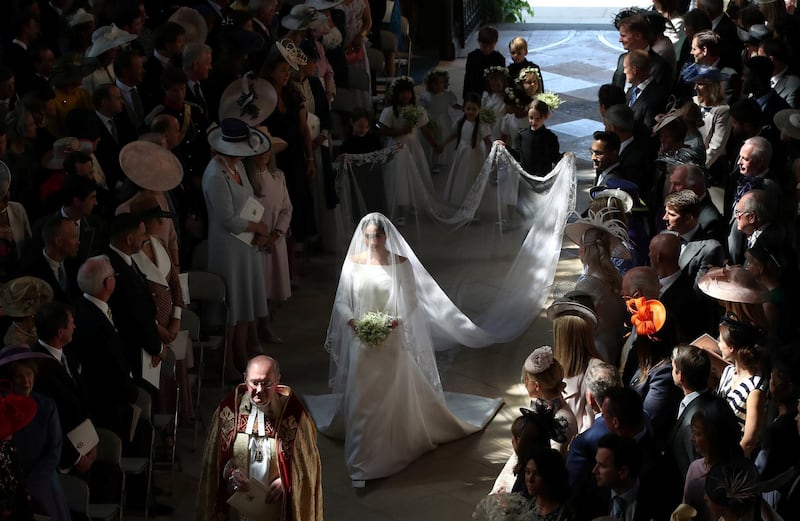 Meghan Markle walks down the aisle as she arrives in St George's Chapel at Windsor Castle for her wedding to Prince Harry in Windsor, Britain, May 19, 2018. Danny Lawson/Pool via REUTERS