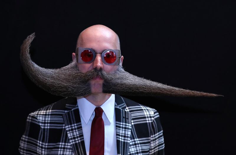 A participant of the international World Beard and Moustache Championships poses before taking part in one of the 17 categories of beard and moustache styles competing in Antwerp, Belgium. Reuters