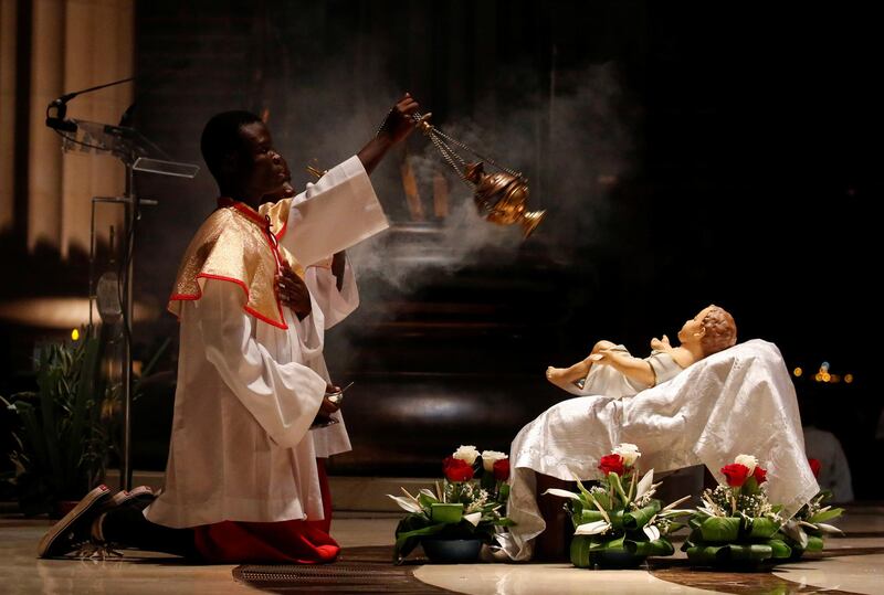 Altar boys attend the celebration of Christmas at the Basilica Notre Dame in Yamoussoukro, Ivory Coast. Reuters