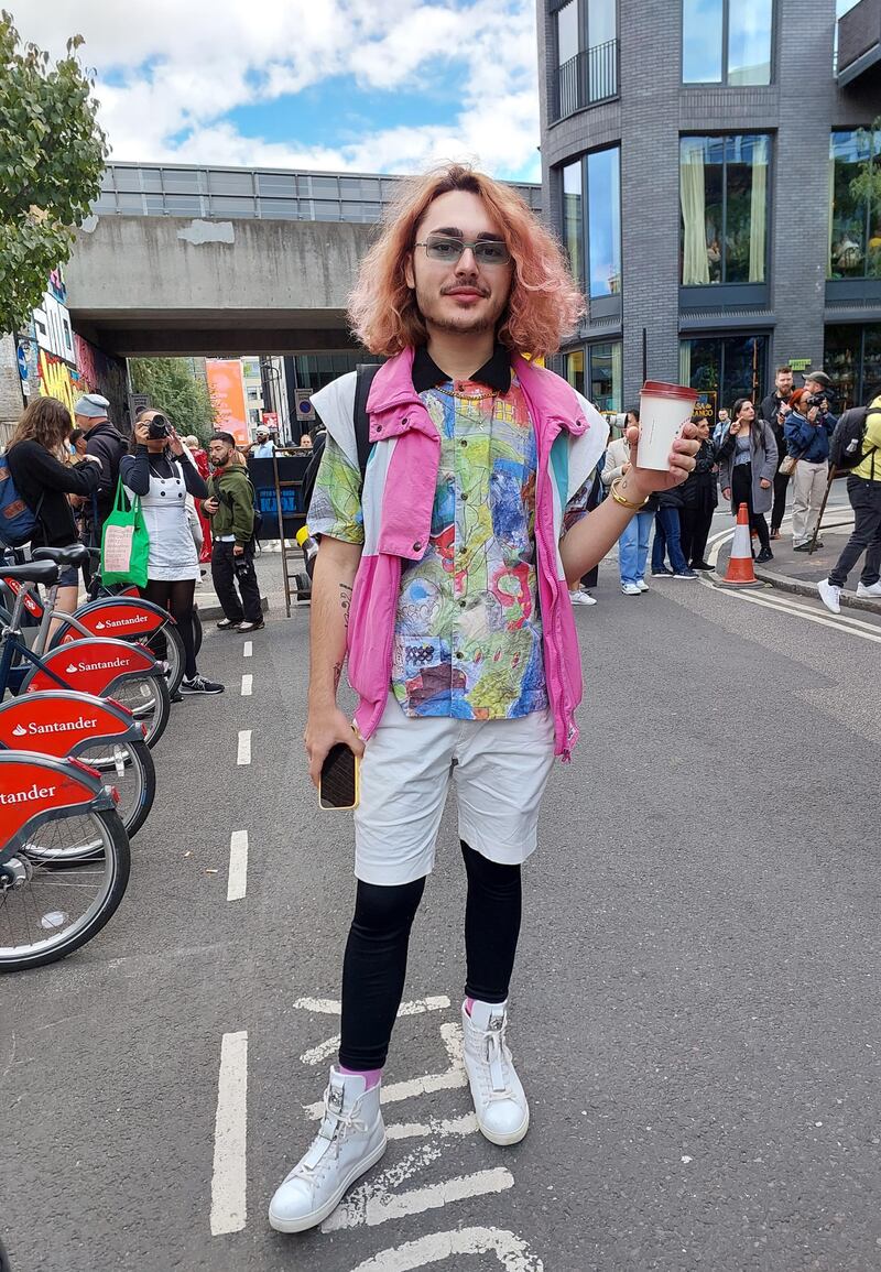 Channelling the 1980s in body-warming leggings and bright-sleeved shirt. 