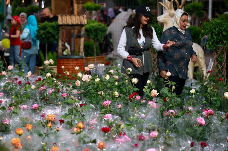 People visit the Baghdad International Festival of Flowers and Gardens to mark Nowruz. AFP