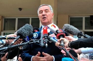 The presidential candidate of the ruling Democratic party of Socialist Milo Djukanovic addresses the media after casting his vote. AFP