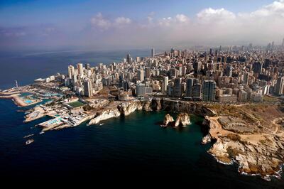 An aerial view of the Lebanese capital Beirut and its Raouche Rocks (C-R), also known as Pigeon Rocks, on October 27, 2020. / AFP / THOMAS COEX
