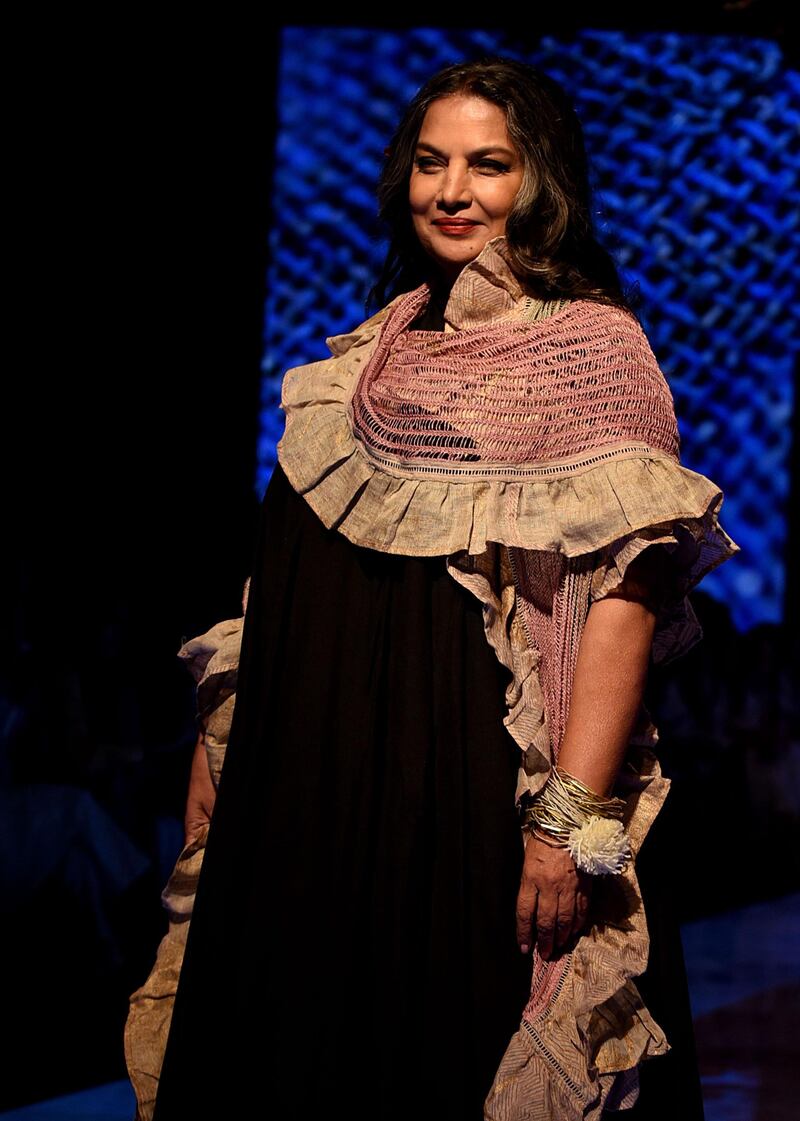 Indian Bollywood actress Shabana Azmi presents a creation by designer Kaveri at Lakme Fashion Week (LFW) Winter/Festive 2019 in Mumbai on August 25, 2019.  / AFP / Sujit Jaiswal
