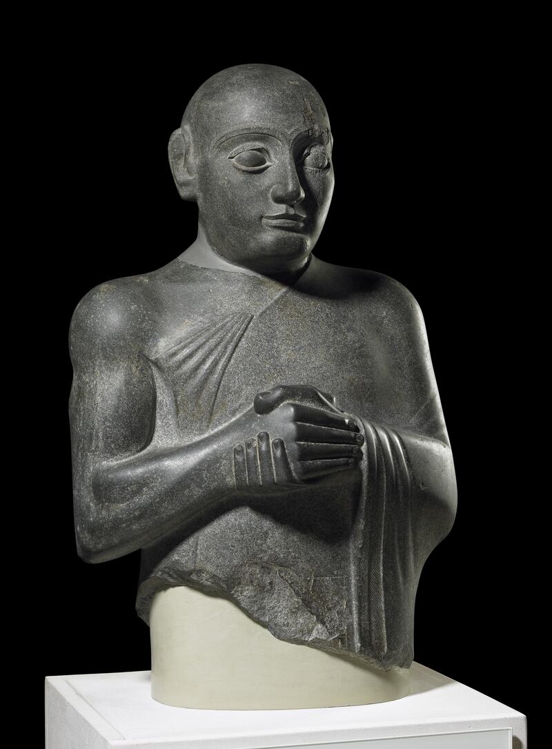 A statue of King Gudea found in Girsu, dating from circa 2130 BC. The statue and other items from Iraq are currently on show as part of the Ancient Iraq: New Discoveries exhibition in Nottingham in the UK. Photo: British Museum