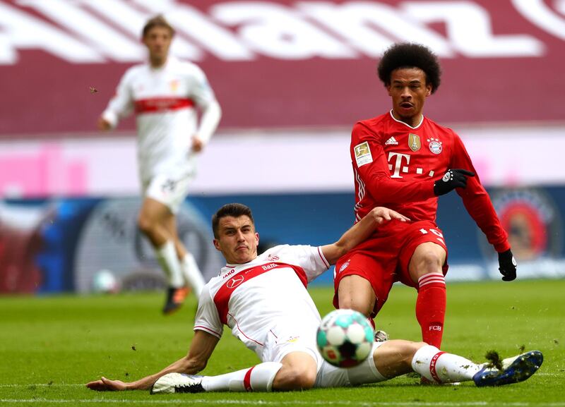 Stuttgart's Marc-Oliver Kempf challenges Bayern winger Leroy Sane. AP