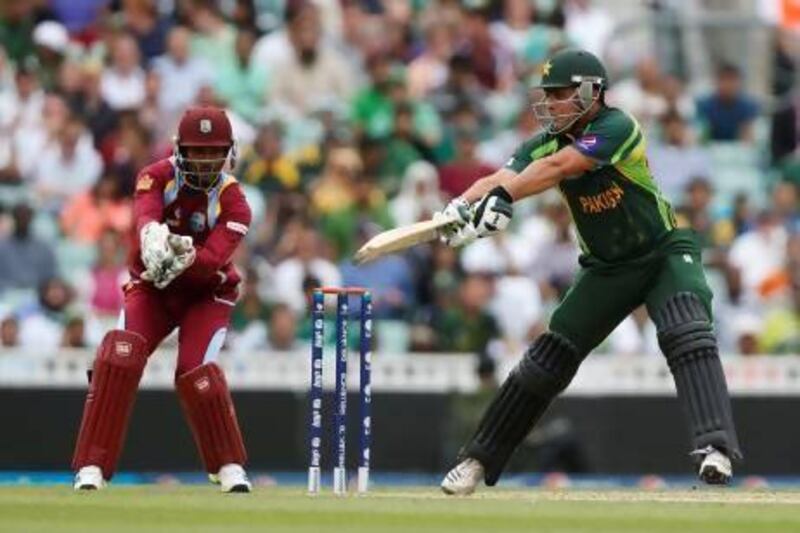 West Indies’ wicketkeeper Denesh Ramdin, left, left no doubt on catching out Pakistan’s Kamran Akmal here, but a later juggled and dropped attempt against Misbah-ul-Haq brought up questions of whether he violated the ‘spirit’ of the game by pretending to have made the play.