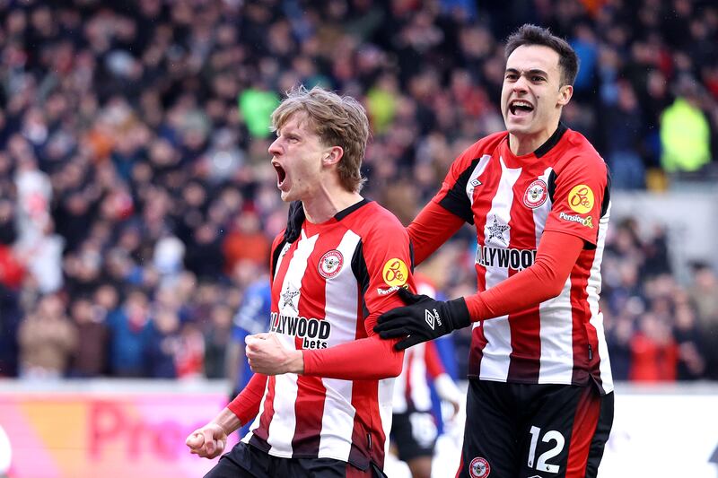 Mads Roerslev of Brentford celebrates scoring his team's first goal against Chelsea with teammate Sergio Reguilon. Getty Images