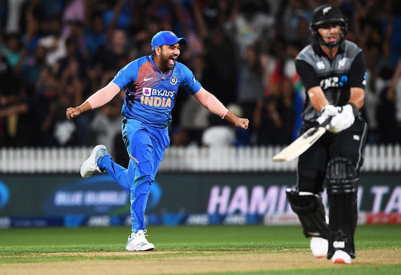 India's Rohit Sharma celebrates after New Zealand batsman Ross Taylor is bowled meaning their T20 international in Hamilton on Wednesday, January 29, finished in a tie. India then won the super over after Rohit cracked a six off the final ball. AP