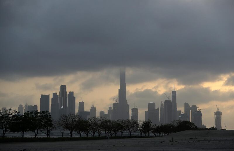 DUBAI, UNITED ARAB EMIRATES , April 15 – 2020 :- Dark clouds over Dubai skyline during the rain in Dubai. (Pawan Singh/The National) For News/Standalone/Online/Instagram.