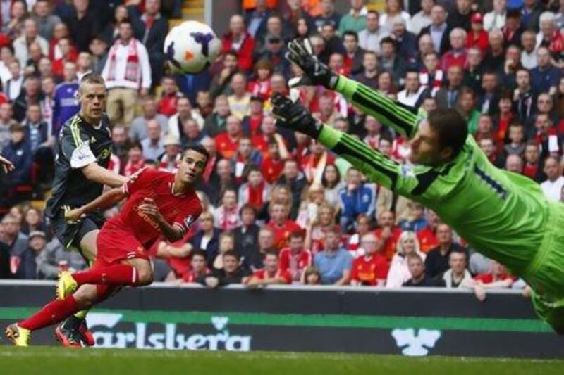 Stoke City goalkeeper Asmir Begovic makes a save from Liverpool's Philippe Coutinho.