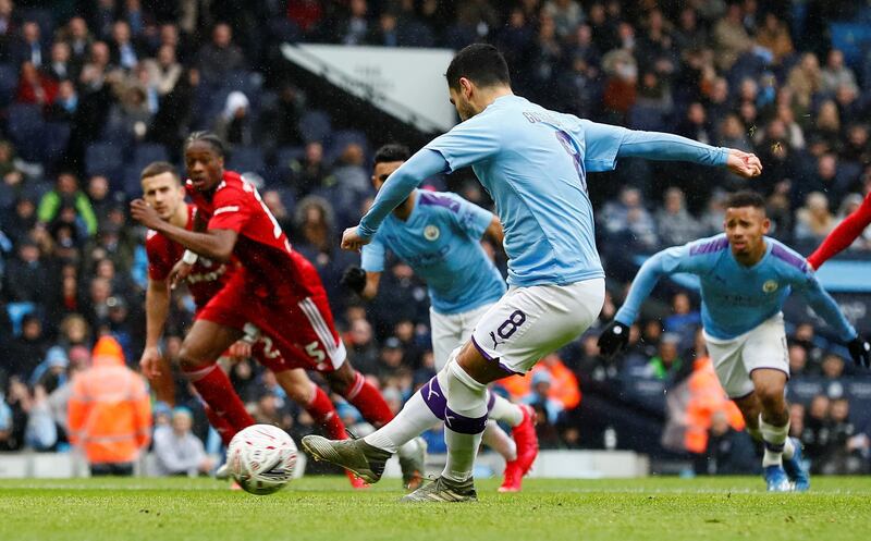 Ilkay Gundogan scores from the spot. Reuters