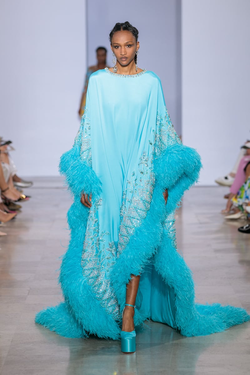 A blue kaftan lined with feathers.