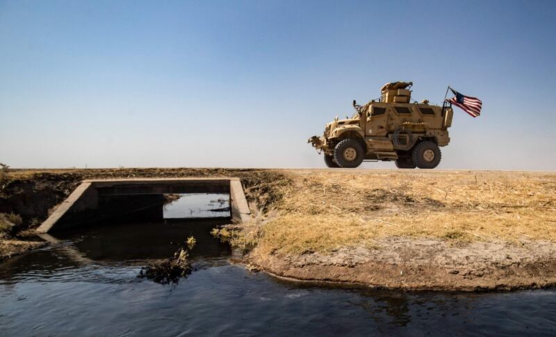 A US military vehicle patrols near the Rumaylan oil fields in Hassakeh province. AFP