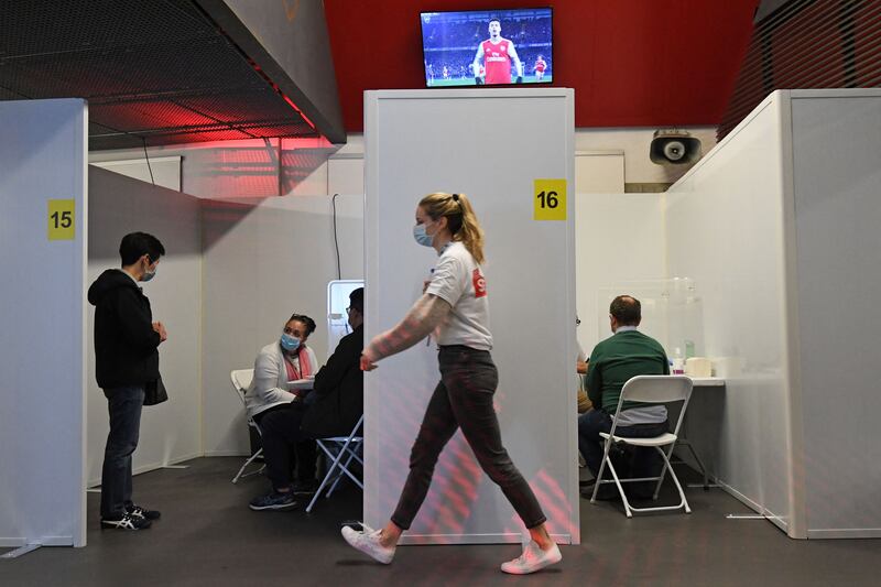 People receive their vaccine doses at the Emirates Stadium.