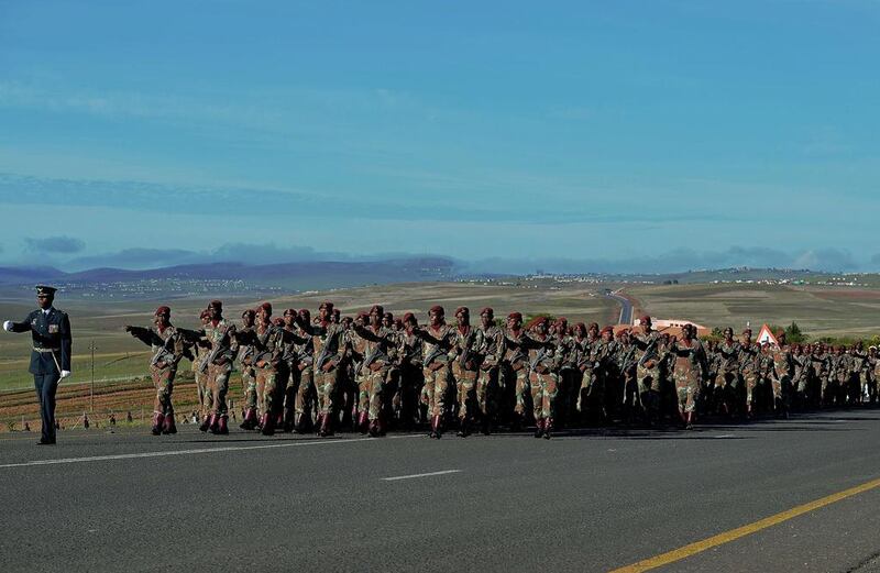 South African armed forces parade before the funeral procession carrying the coffin of Mandela. Carl de Souza / AFP Photo