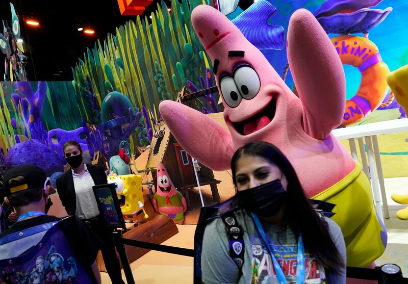 Fan Leslie Acosta poses with Patrick Star from the animated television series 'SpongeBob Squarepants'. AP Photo