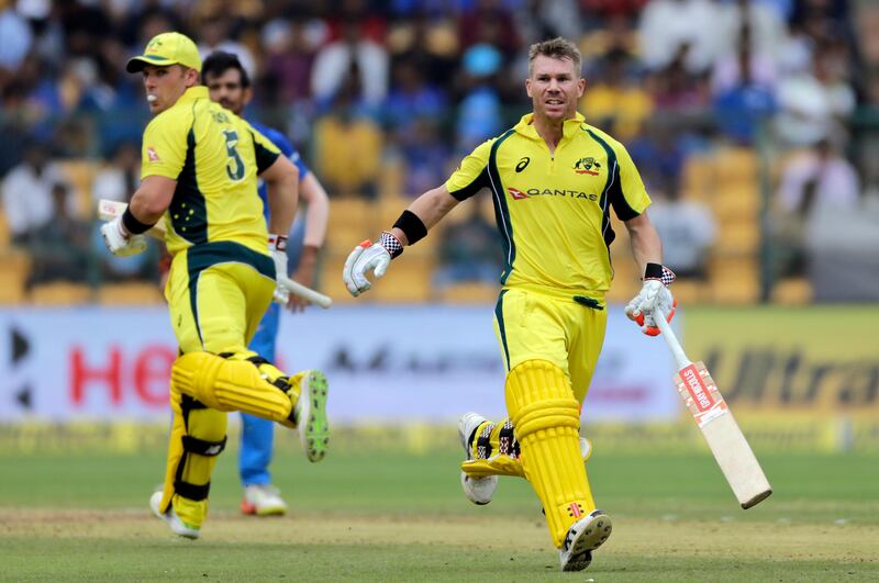 Australia cricketers David Warner, right, and Aaron Finch run between the wickets during the forth one-day international cricket match between India and Australia in Bangalore, India, Thursday, Sept. 28, 2017. (AP Photo/Rajanish Kakade)