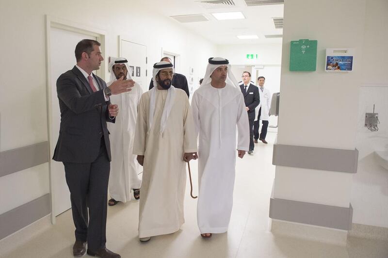 Sheikh Tahnoon bin Mohammed, Ruler’s Representative in the Eastern Region, centre, and Sheikh Hazza bin Zayed, National Security Adviser, right, at the new Oasis Hospital facility. Rashed Al Mansoori / Crown Prince Court – Abu Dhabi