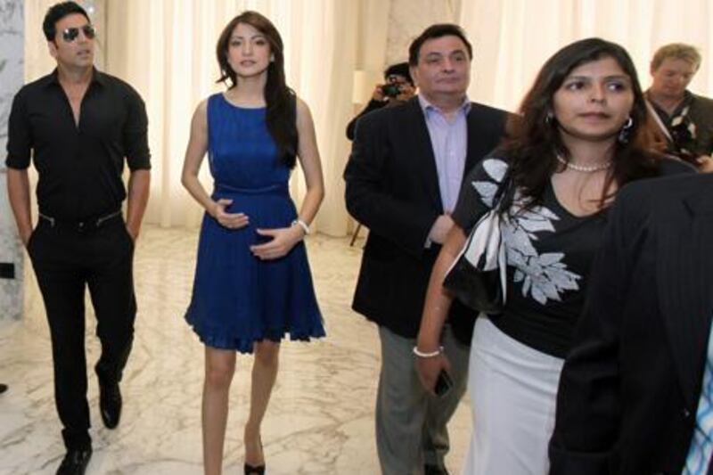 DUBAI, UNITED ARAB EMIRATES - FEBRUARY 9:  From left: Bollywood stars Akshay Kumar, Anushka Sharma, and Rishi Kapoor arrive at a press conference to launch the opening of their new film, Patiala House, at Le Meridien Hotel in Dubai on February 9, 2011.  (Randi Sokoloff for The National)  For News story by Ramola