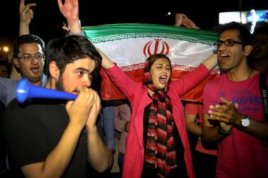Iranians celebrate a landmark nuclear deal in Tehran in July, 2015. AP