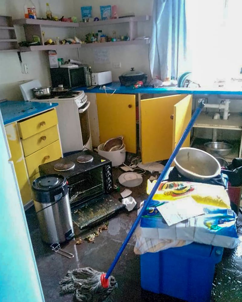 Debris lies strewn across the floor in the kitchen of Renagi Ravu's house in the town of Kainantu, following the quake.
