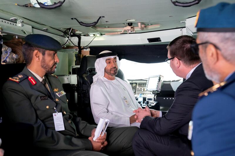 ABU DHABI, UNITED ARAB EMIRATES - February 20, 2019: HH Sheikh Mohamed bin Zayed Al Nahyan, Crown Prince of Abu Dhabi and Deputy Supreme Commander of the UAE Armed Forces (2nd L) visits Nexter stand, during the 2019 International Defence Exhibition and Conference (IDEX), at Abu Dhabi National Exhibition Centre (ADNEC). Seen with HE Brigadier General Saleh Mohamed Saleh Al Ameri, Commander of the UAE Ground Forces (L).
( Ryan Carter for the Ministry of Presidential Affairs )
---