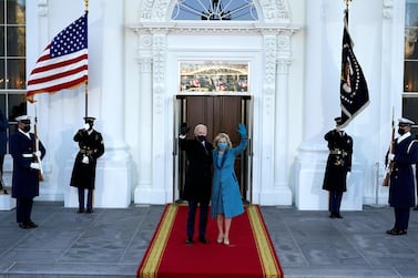 President Joe Biden and first lady Jill Biden wave as they arrive at the North Portico of the White House, Wednesday, Jan. 20, 2021, in Washington. (AP Photo/Alex Brandon, Pool)
