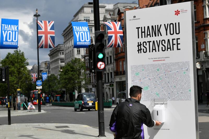 A person is seen at a hand sanitiser station in Oxford Street, following the outbreak of the coronavirus disease (COVID-19), London, Britain, June 11, 2020. REUTERS/Toby Melville