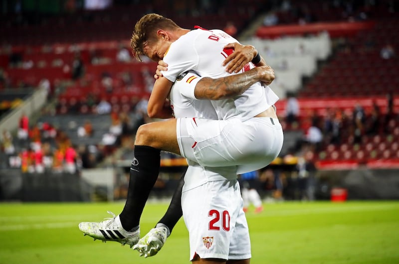 Sevilla's Luuk de Jong (up) celebrates with teammate Diego Carlos after making the score 1-1. EPA