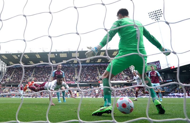 Ollie Watkins heads home Aston Villa's third goal at Burnley. PA