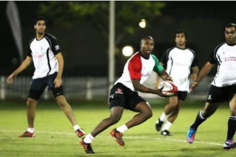 South Africa's Mzo Mbona, centre, is one of two players for the UAE at the Dubai Sevens.